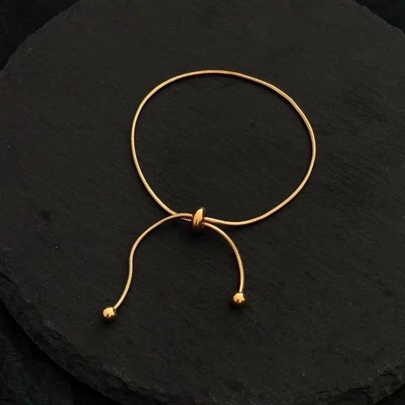 Bracelet doré boule simple réglable